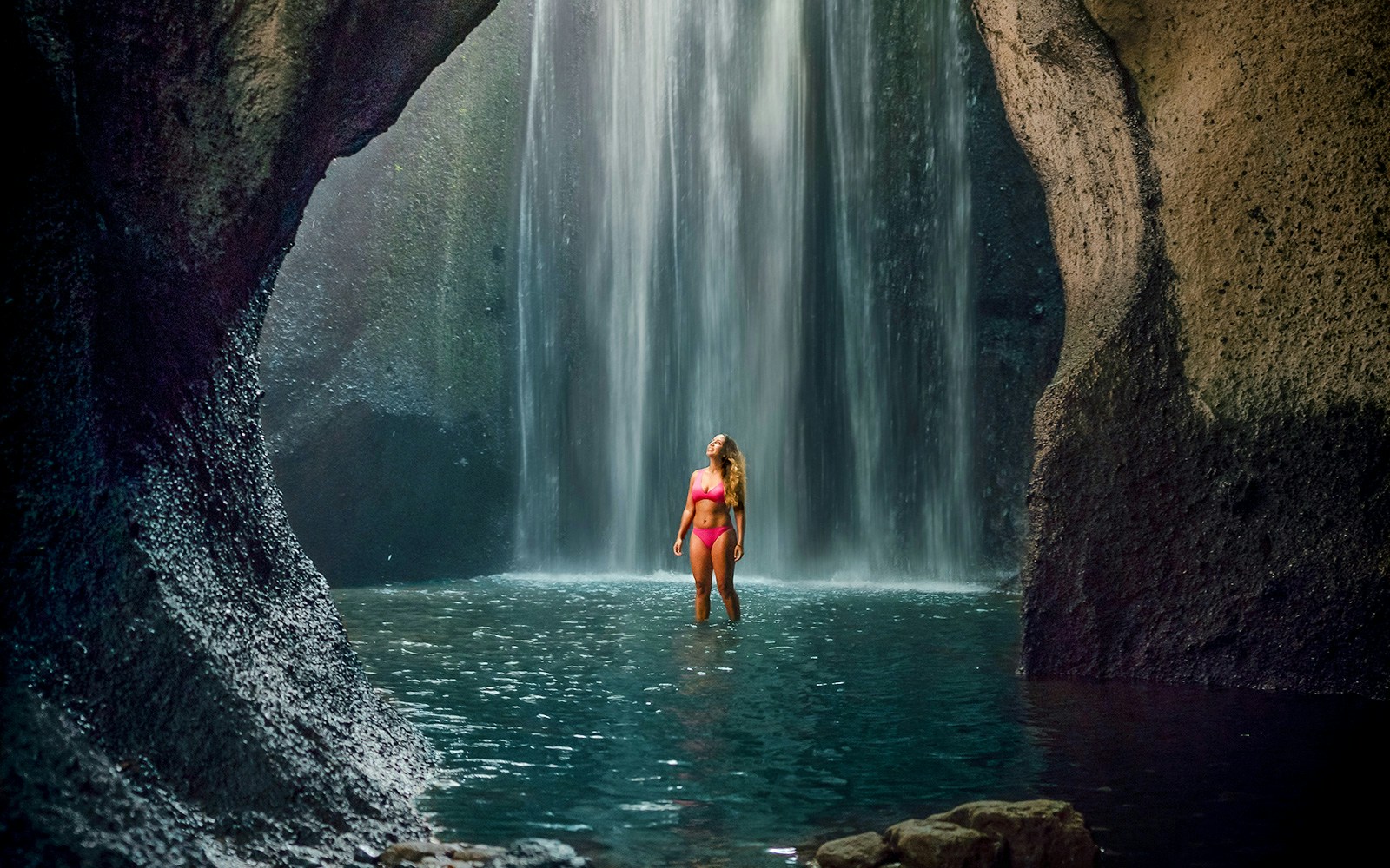 Adventurous Traveler at the Enchanting Tukad Cepung Waterfall