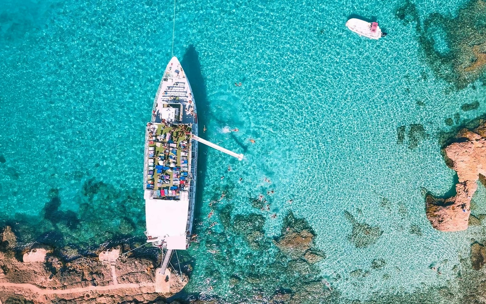 Cruise ship in Blue Lagoon, Malta, viewed from above.
