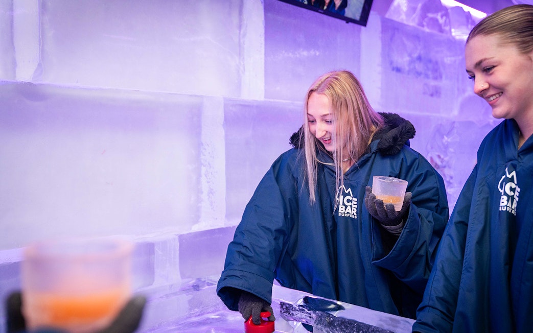 Guests enjoying drinks at IceBar Surfers Paradise, surrounded by ice walls.
