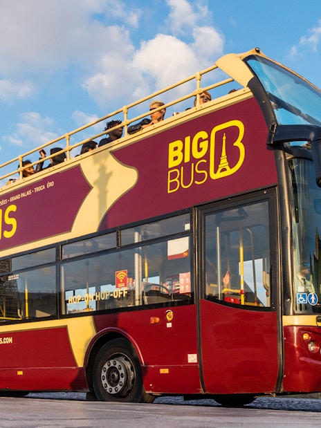 Tourists on Big Bus in front of the Pantheon, Paris, starting city tour.