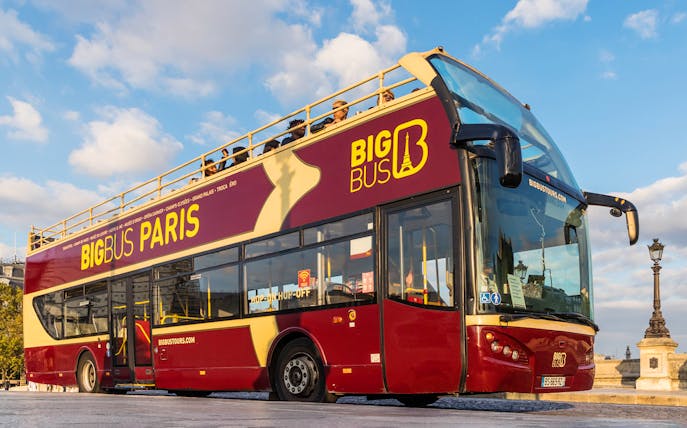 Tourists on Big Bus in front of the Pantheon, Paris, starting city tour.