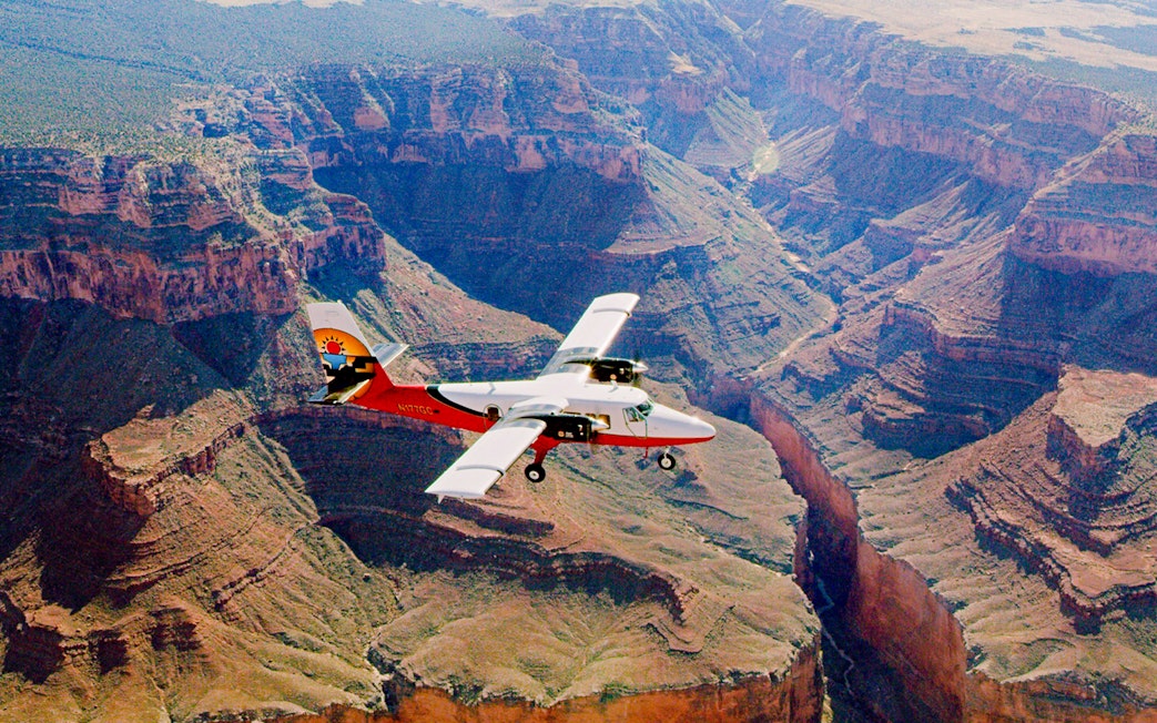 Aircraft flying over the Grand Canyon, showcasing the vast canyon landscape.