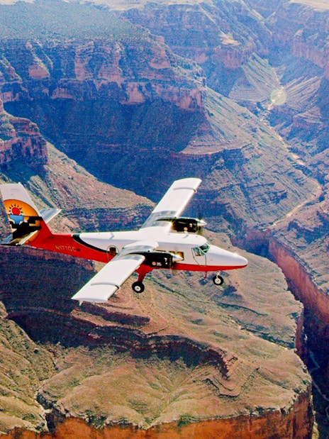 Aircraft flying over the Grand Canyon, showcasing the vast canyon landscape.