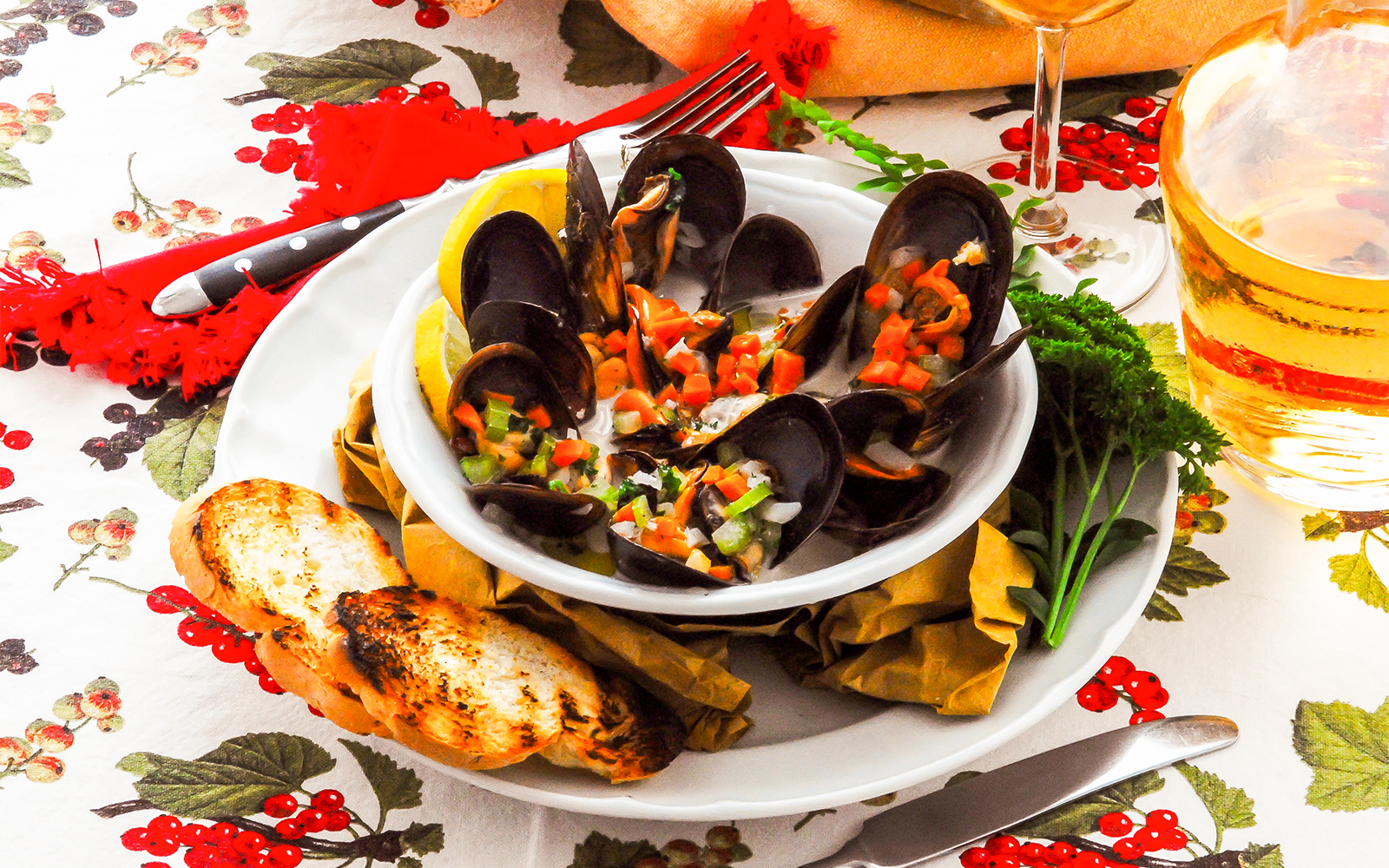 Zuppa di cozze served in a white bowl with fresh mussels and herbs in Italy.