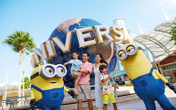 Family with Minions at Universal Studios Singapore globe.