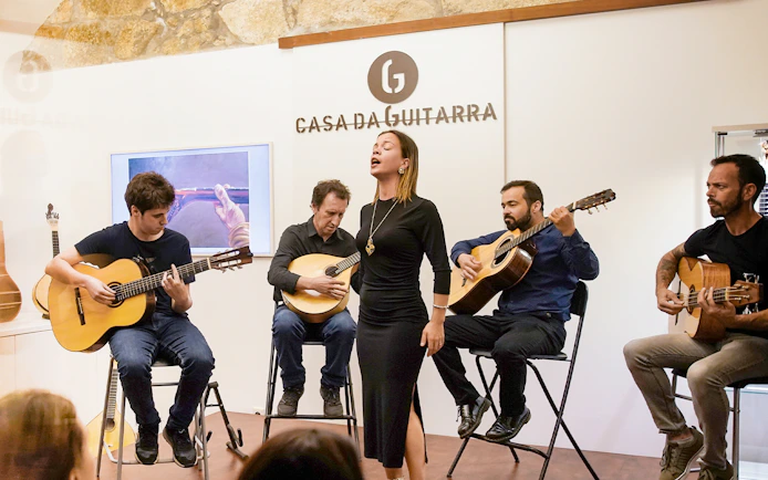 Musicians performing at a Fado show in Casa da Guitarra, Porto.
