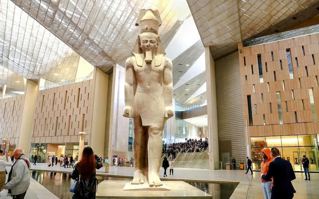 Statue of Pharaoh in Grand Hall of the Grand Egyptian Museum, Giza, Cairo day trip from Hurghada.