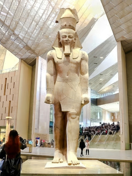Statue of Pharaoh in Grand Hall of the Grand Egyptian Museum, Giza, Cairo day trip from Hurghada.