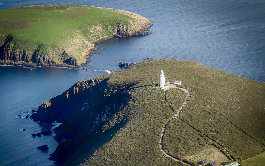 Bruny Island lighthouse on a cliff overlooking the ocean, Tasmania.