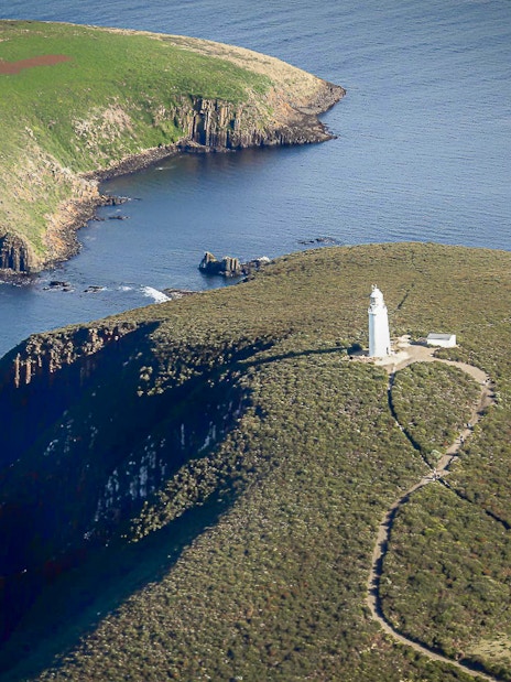 Bruny Island lighthouse on a cliff overlooking the ocean, Tasmania.