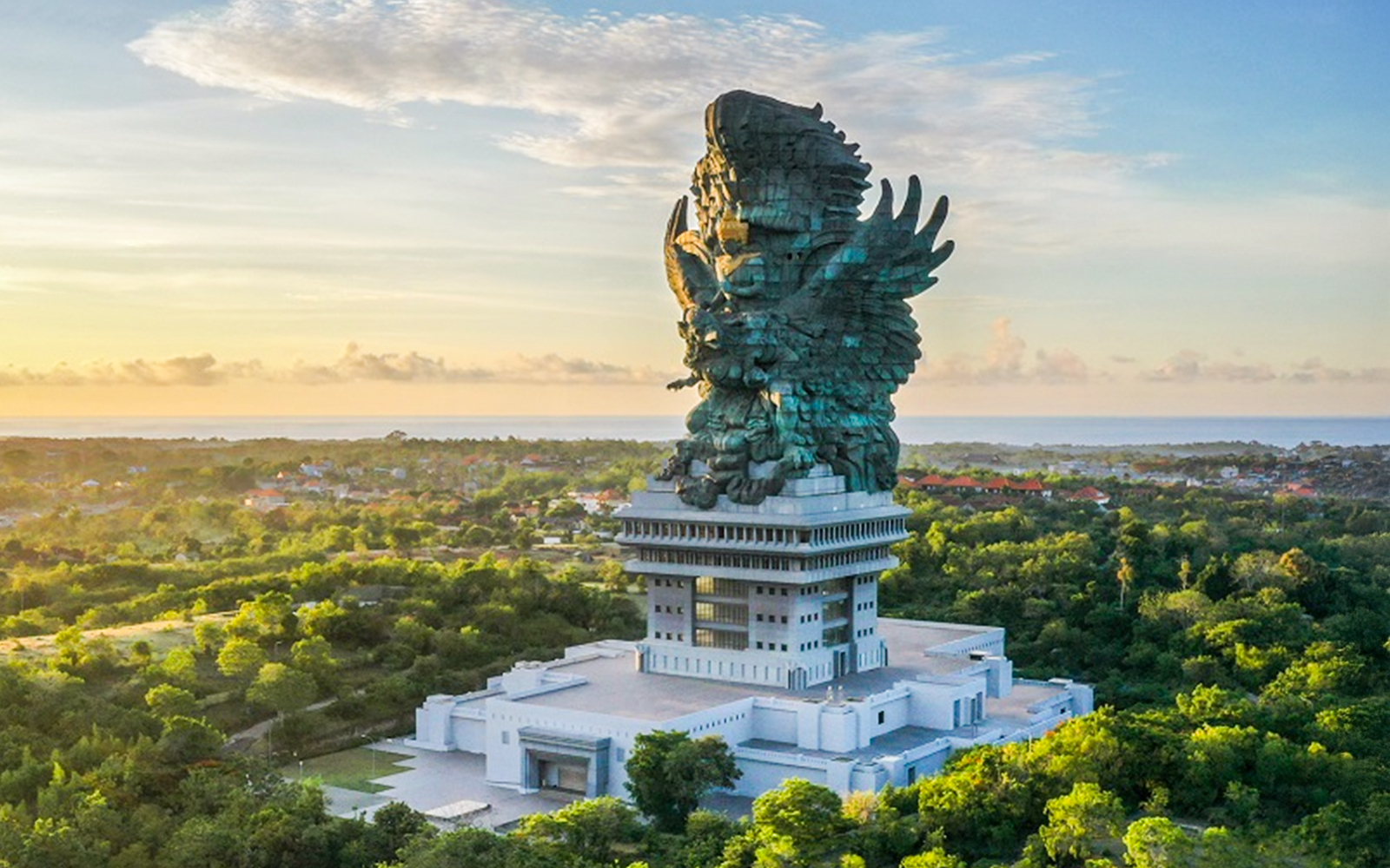 Garuda Wisnu Kencana statue in Bali, Indonesia, surrounded by lush greenery.