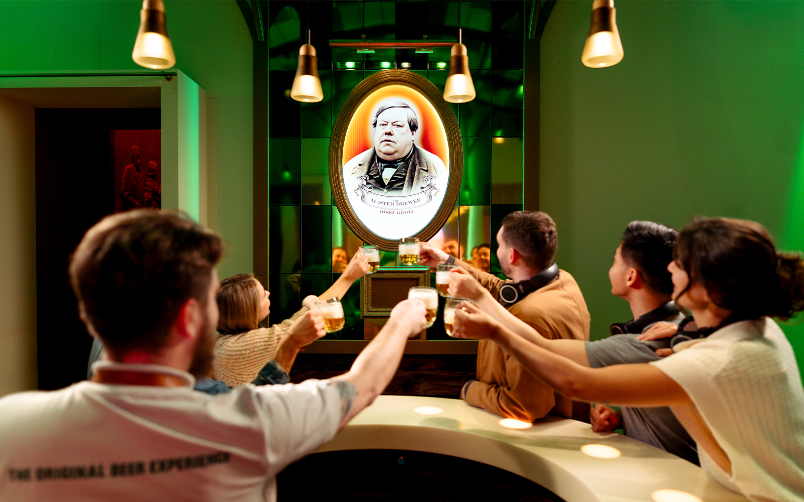 Group toasting with beer at Prague Pilsner Urquell Experience.