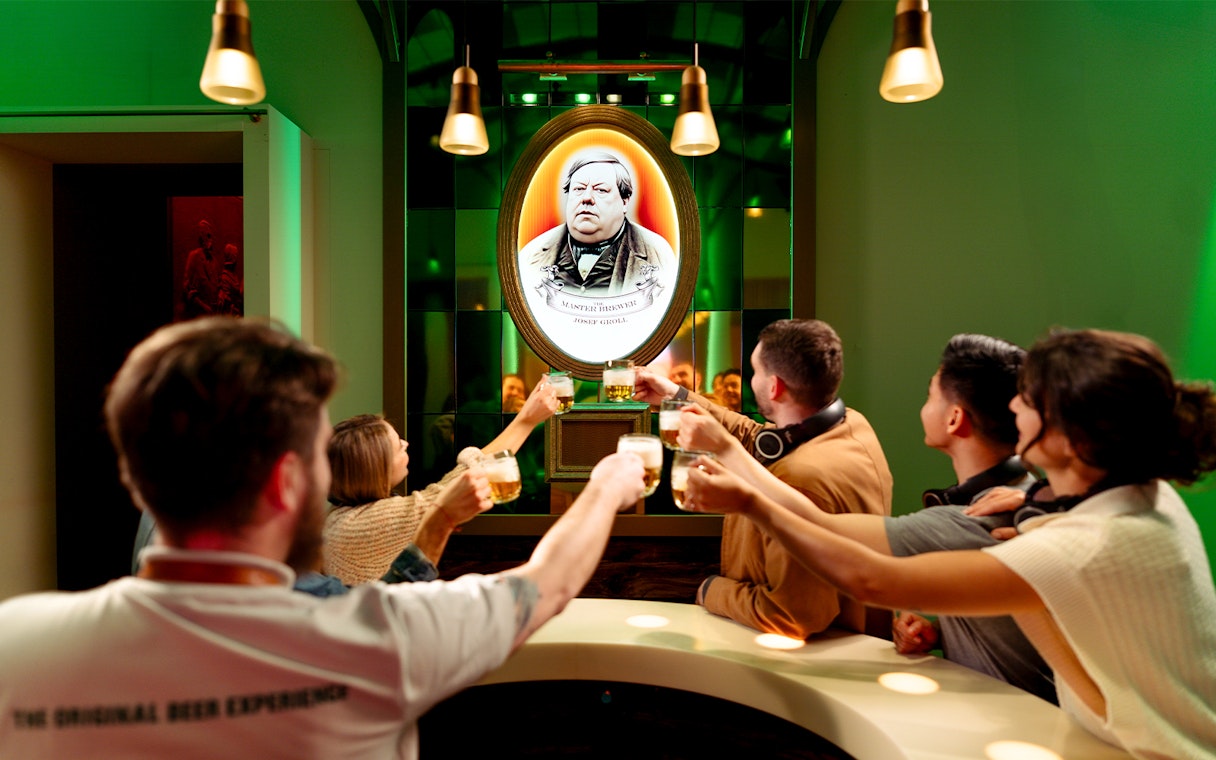 Group toasting with beer at Prague Pilsner Urquell Experience.