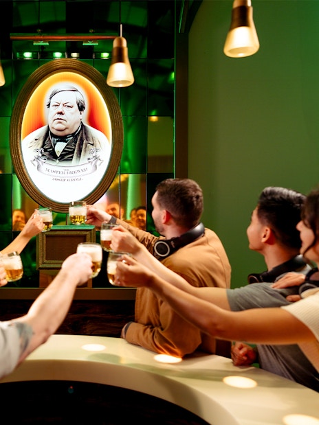 Group toasting with beer at Prague Pilsner Urquell Experience.