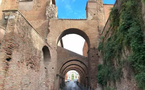 Roman brick arches on Celio Hill, Rome, leading to ancient underground houses.