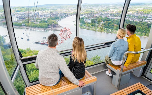 Guests enjoying the Koblenz skyline from a skyglide cabin.