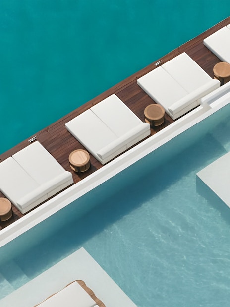 Sun loungers by the pool at Yona Beach Club, Phuket.