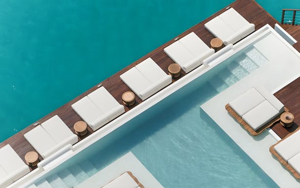 Sun loungers by the pool at Yona Beach Club, Phuket.