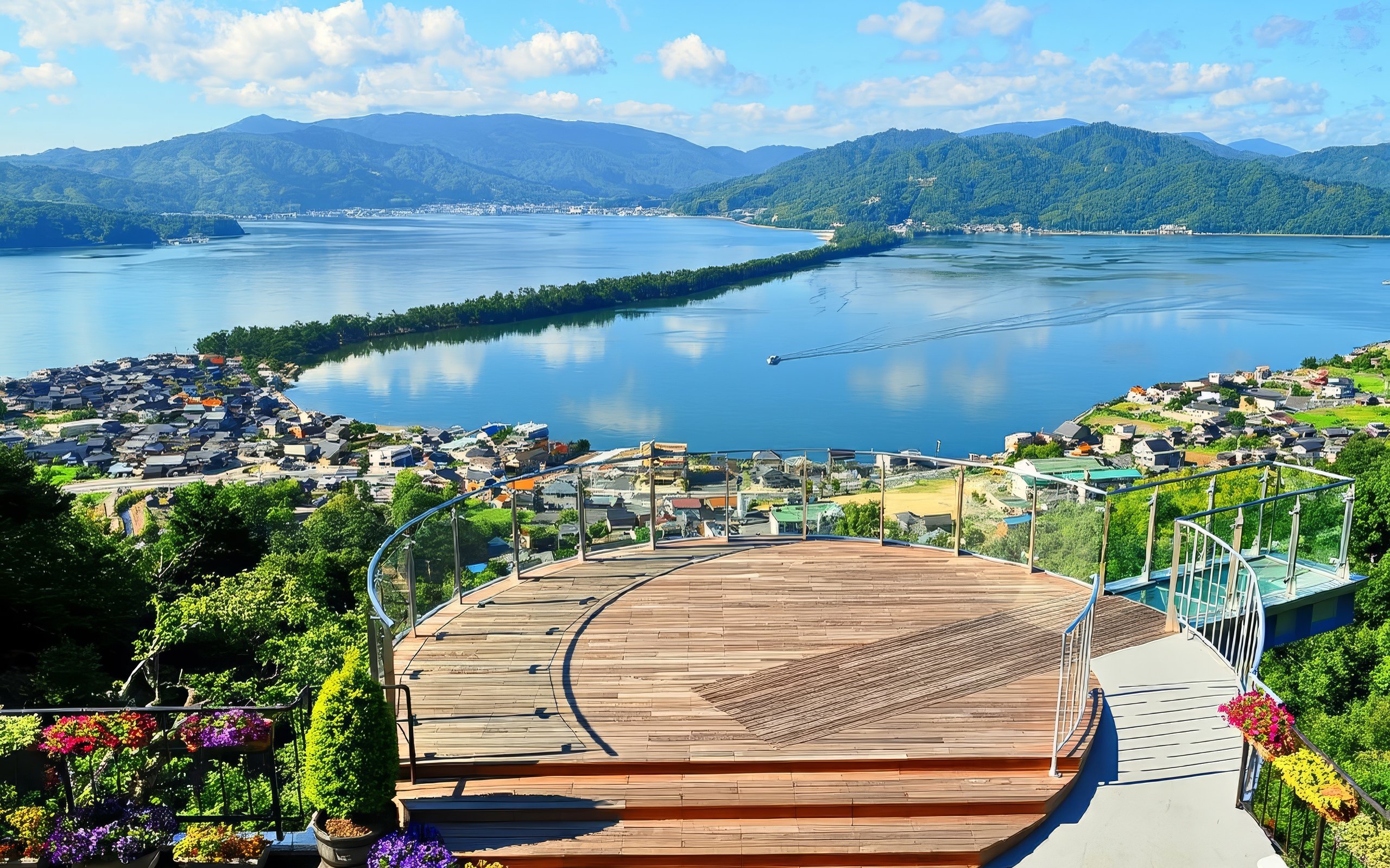 Panoramic view of Amanohashidate sandbar from Kasamatsu Park, Japan, with surrounding mountains and water.