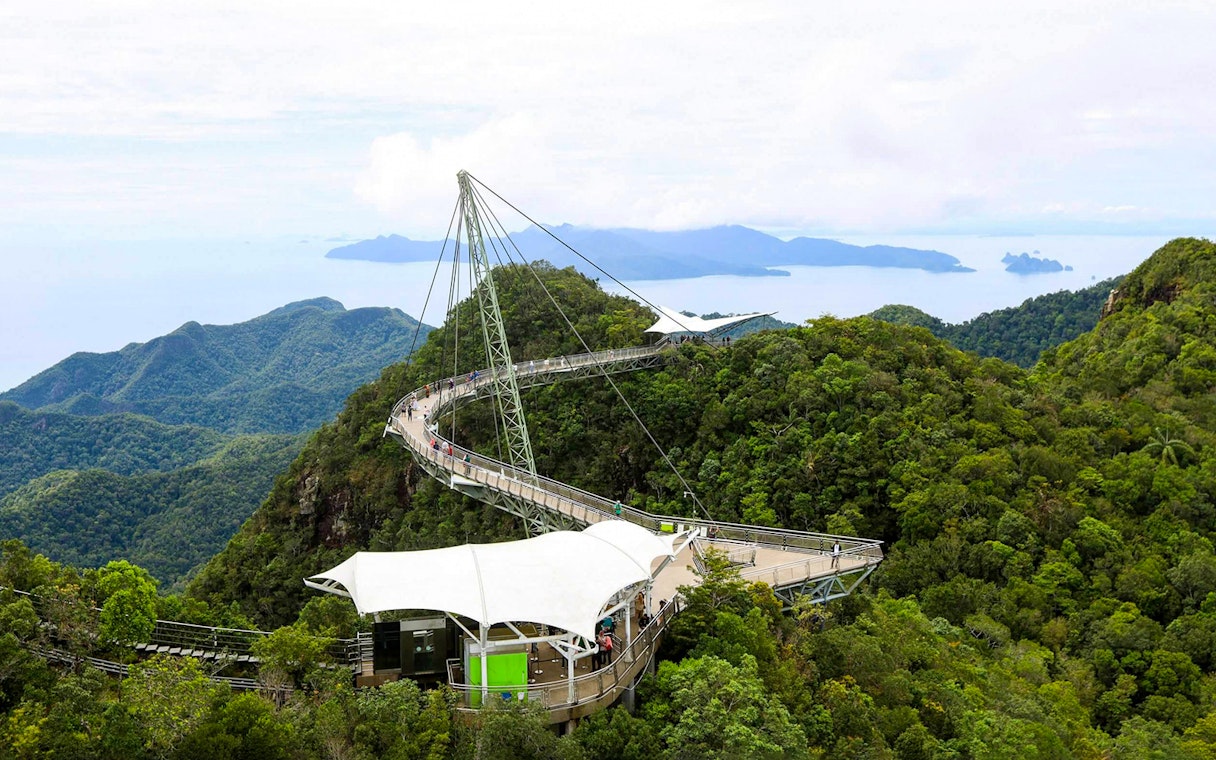 Sky Bridge at Langkawi spanning lush green mountains with distant sea view.