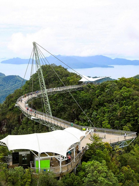 Sky Bridge at Langkawi spanning lush green mountains with distant sea view.