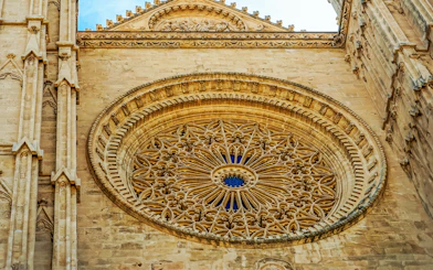 Rose window detail at Palma Cathedral, Mallorca, showcasing intricate Gothic architecture.