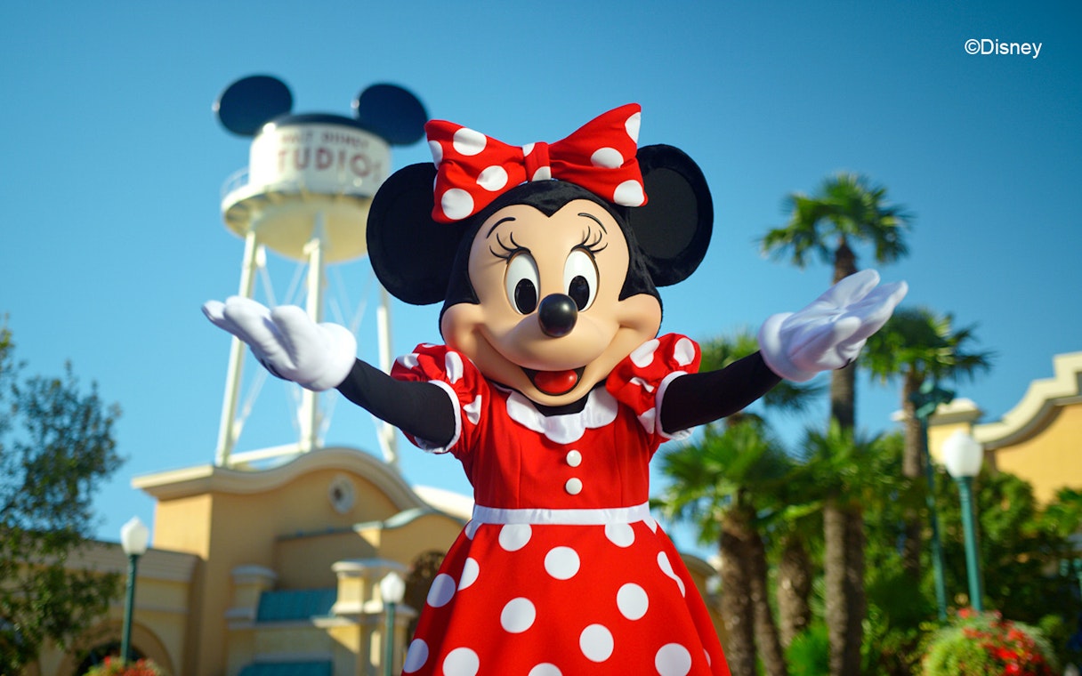 Minnie Mouse at Disneyland Paris with water tower in background.