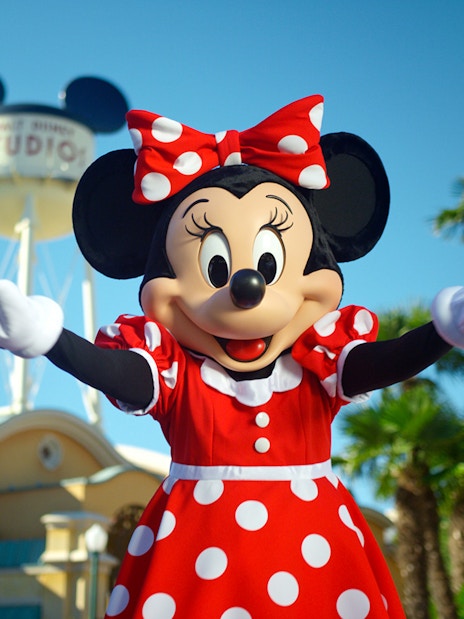 Minnie Mouse at Disneyland Paris with water tower in background.