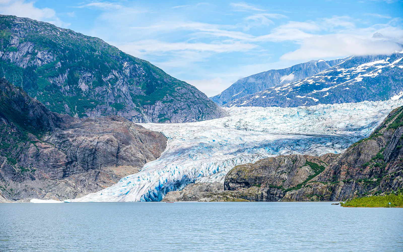 Mendenhall Glacier with surrounding mountains in Juneau, Alaska.