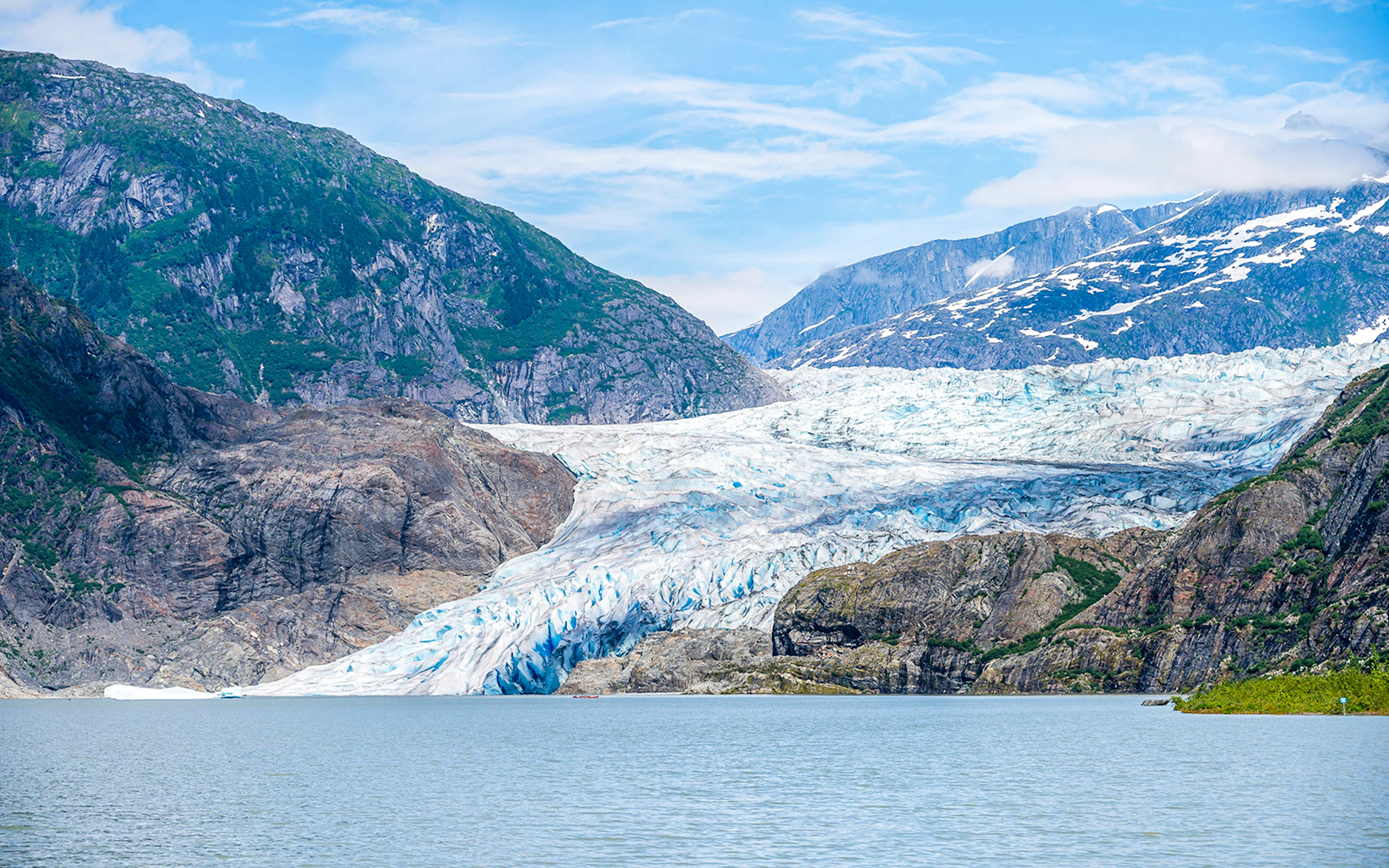Mendenhall Glacier with surrounding mountains in Juneau, Alaska.