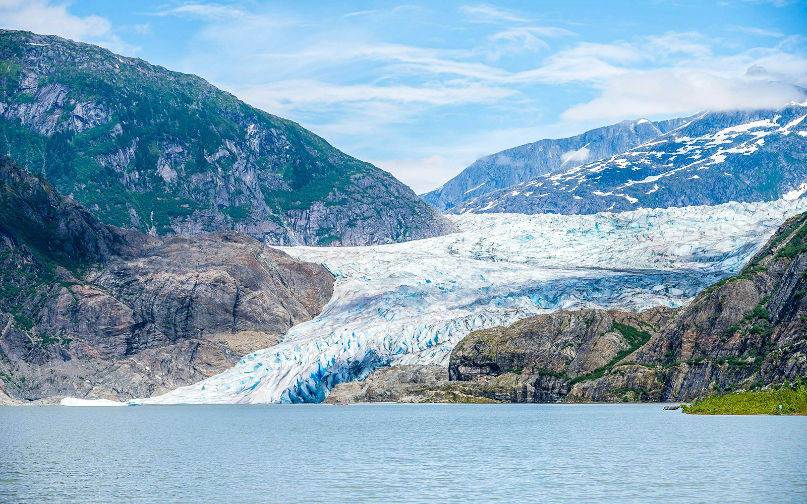 Mendenhall Glacier with surrounding mountains in Juneau, Alaska.