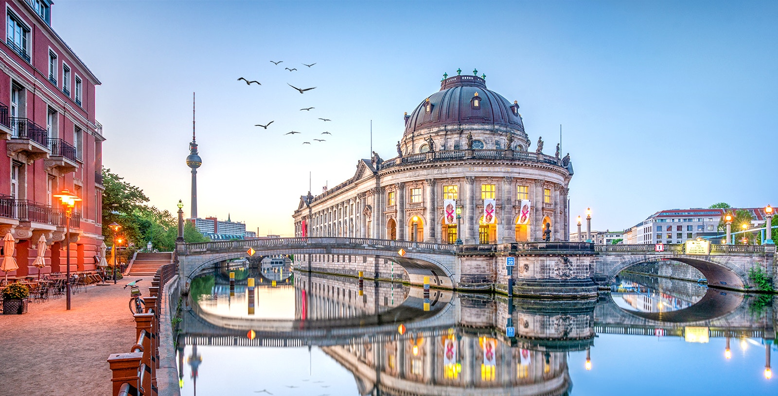 Cruise boat on the Spree River with Berlin Cathedral in the background, Berlin, Germany.