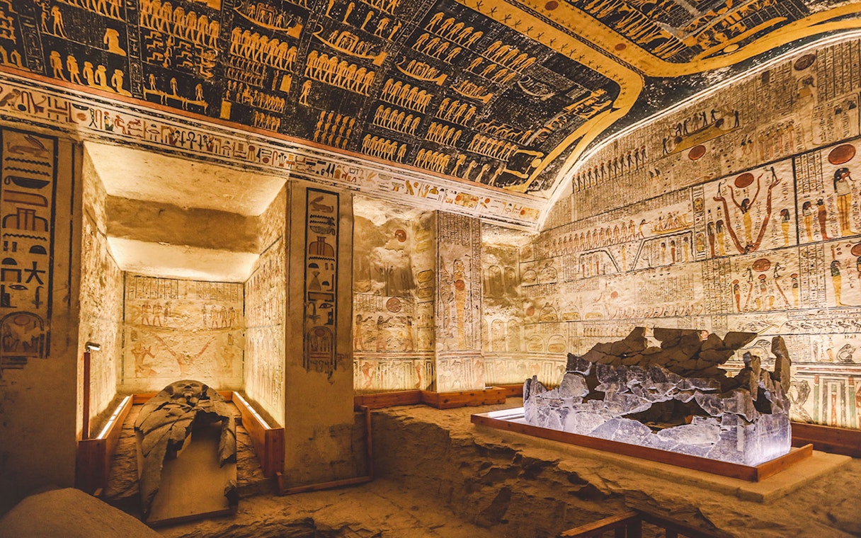 White stone sarcophagus in the Valley of the Kings tomb, Luxor, Egypt, with hieroglyphs.