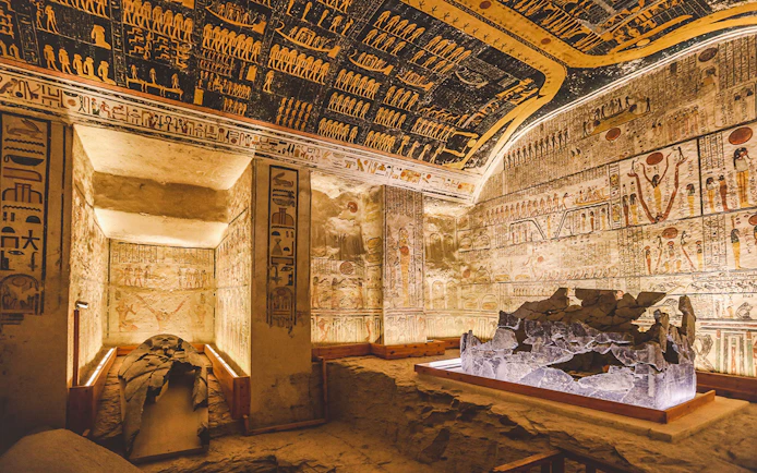 White stone sarcophagus in the Valley of the Kings tomb, Luxor, Egypt, with hieroglyphs.