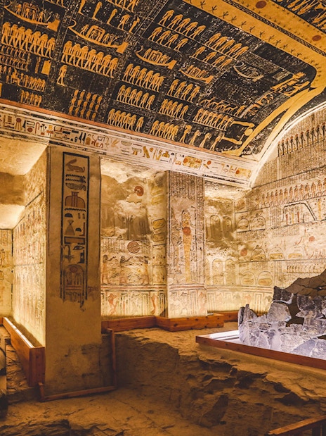 White stone sarcophagus in the Valley of the Kings tomb, Luxor, Egypt, with hieroglyphs.