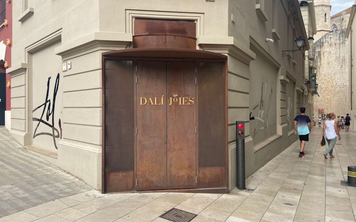 Entrance of Dalí Theatre-Museum in Figueres, Catalonia, Spain, with distinctive brown doors.