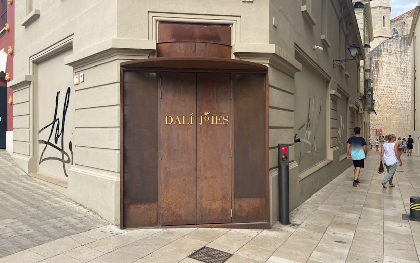 Entrance of Dalí Theatre-Museum in Figueres, Catalonia, Spain, with distinctive brown doors.