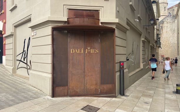 Entrance of Dalí Theatre-Museum in Figueres, Catalonia, Spain, with distinctive brown doors.