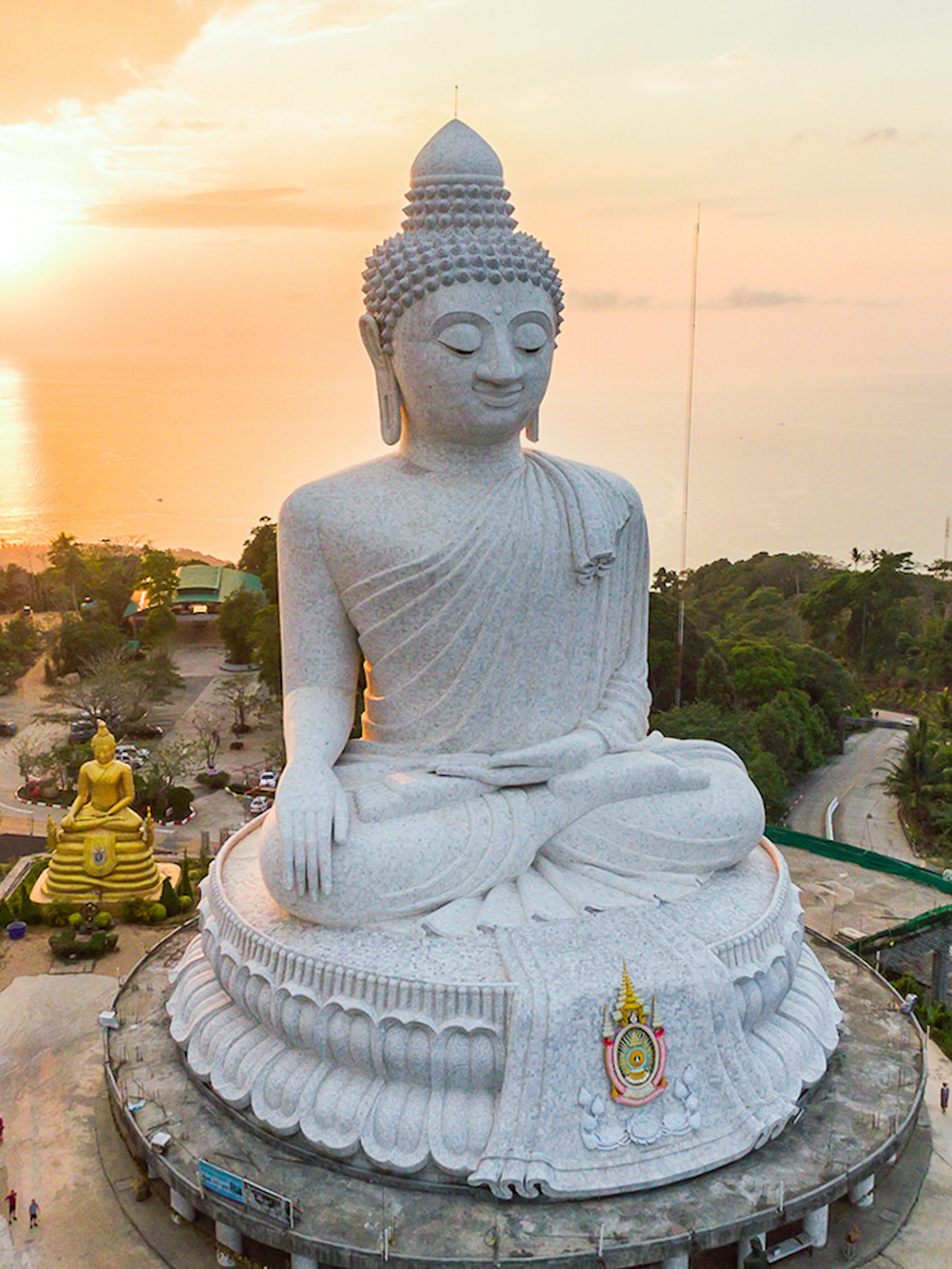 Big Buddha statue overlooking Phuket at sunset during a half-day guided tour.