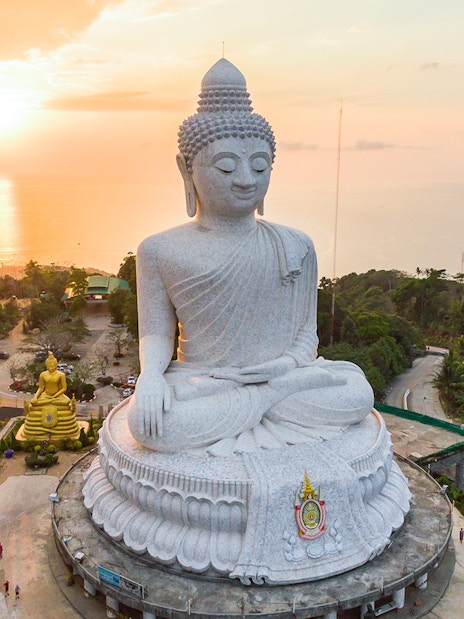 Big Buddha statue overlooking Phuket at sunset during a half-day guided tour.