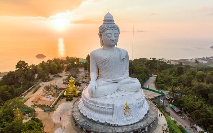 Big Buddha statue overlooking Phuket at sunset during a half-day guided tour.