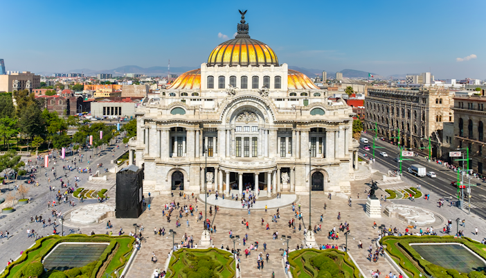 Palace of Fine Arts in Mexico City with intricate architectural details and vibrant cultural exhibits.