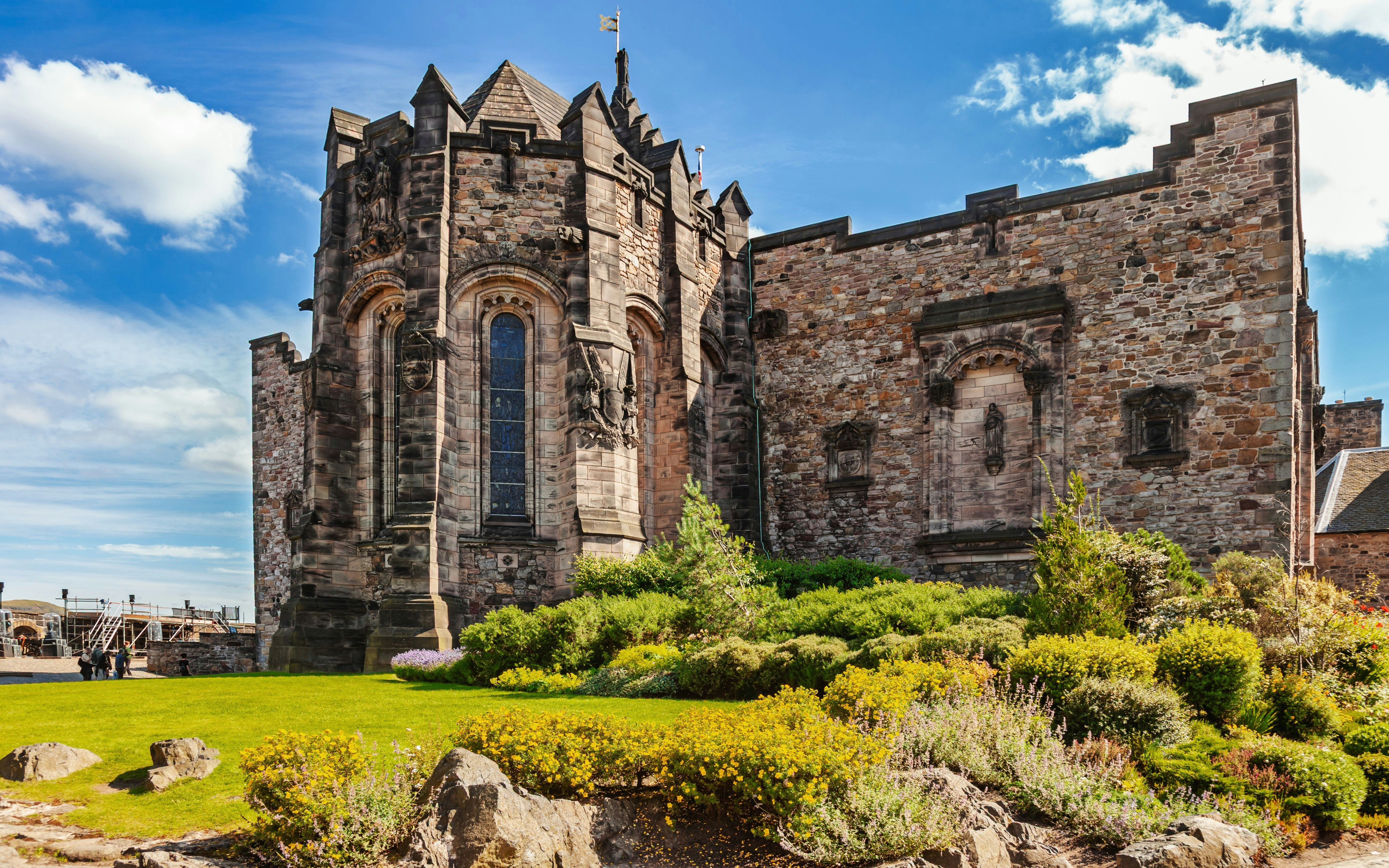 Scottish National War Memorial at Edinburgh Castle with stone architecture and garden.