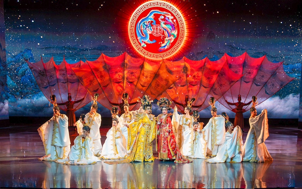 Performers in traditional costumes on stage at Colosseum Cabaret Show, Pattaya.