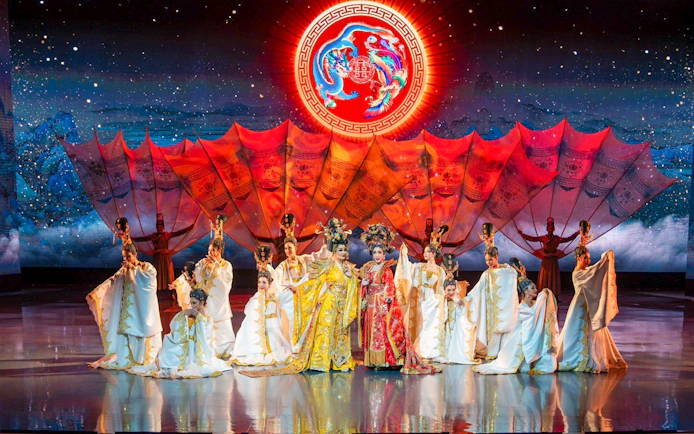 Performers in traditional costumes on stage at Colosseum Cabaret Show, Pattaya.