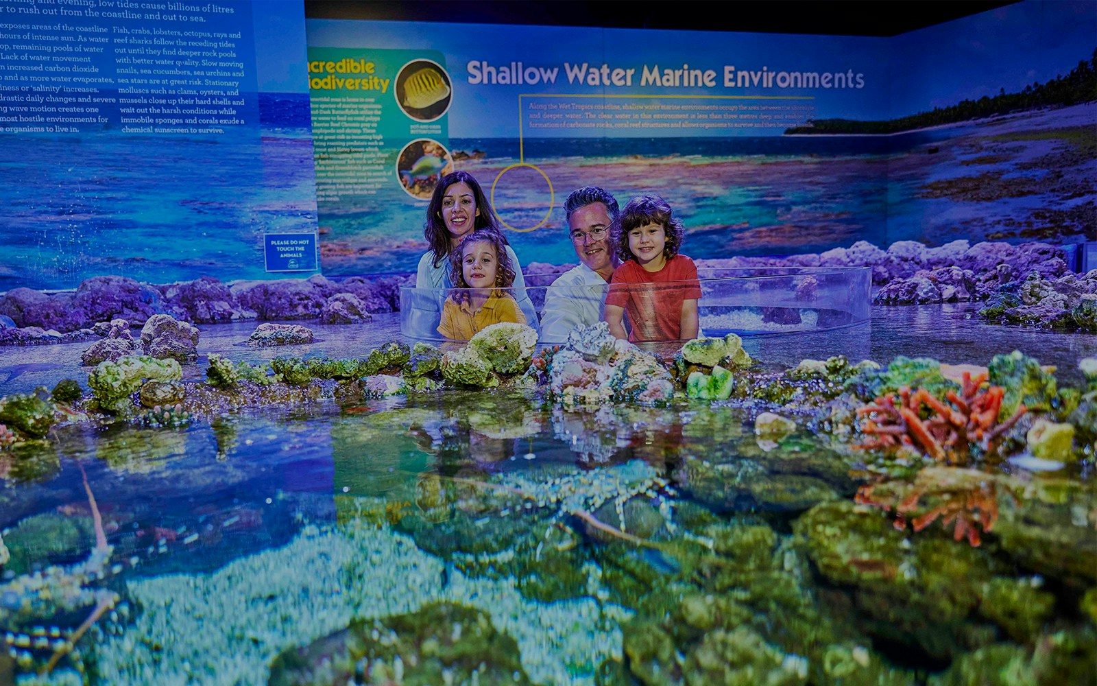 Family looking at coral reef in Cairns Aquarium