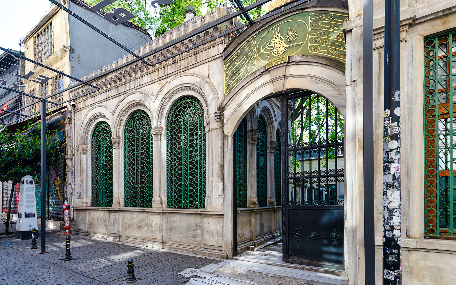 Galata Mevlevihanesi Museum entrance with ornate green ironwork, Istanbul.