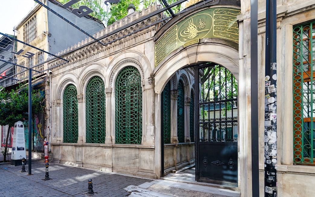 Galata Mevlevihanesi Museum entrance with ornate green ironwork, Istanbul.