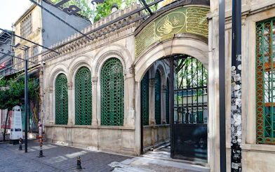 Galata Mevlevihanesi Museum entrance with ornate green ironwork, Istanbul.