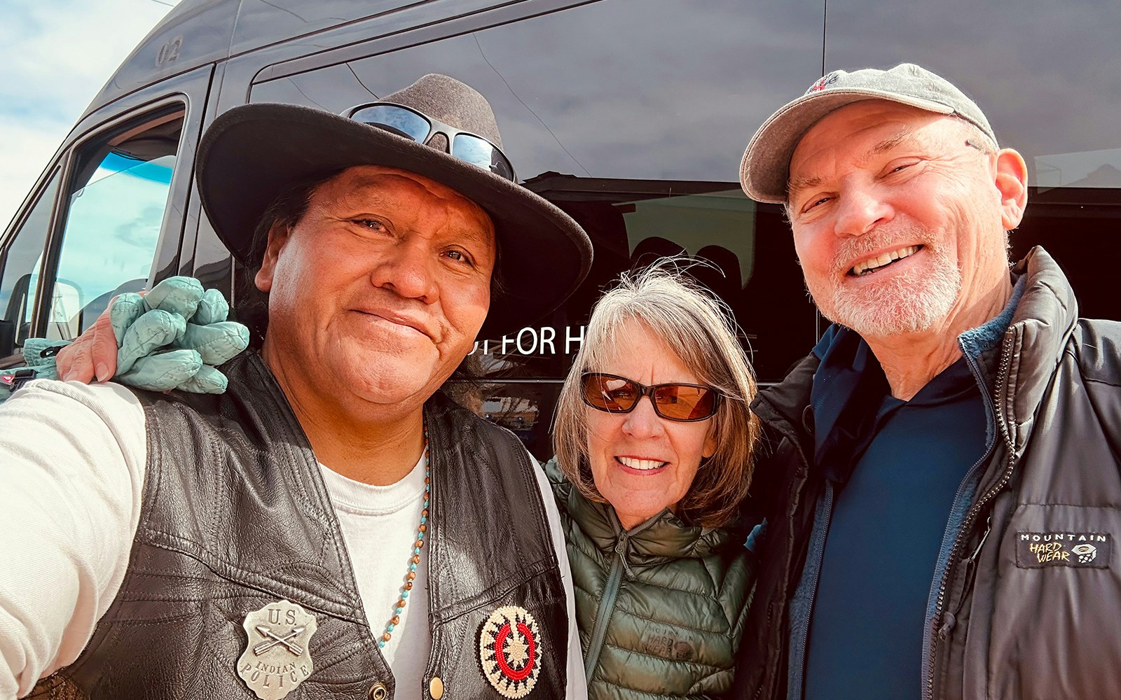 Navajo tour guide with tourists at Antelope Canyon tour.